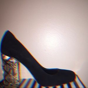 Sued heel, with glass like material &&’ gold.